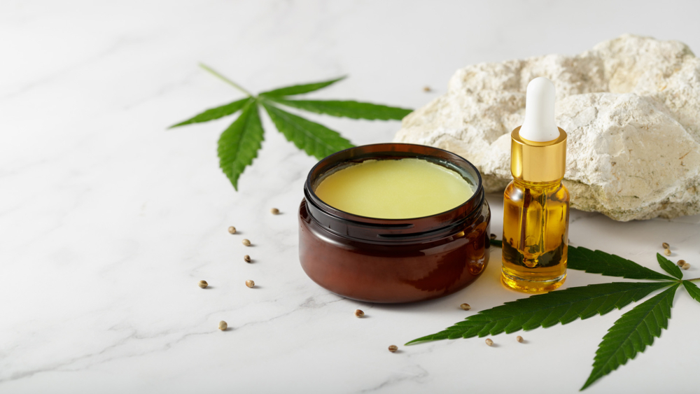 Best CBD Balm UK featured image showing CBD balm and oil on a marble worktop